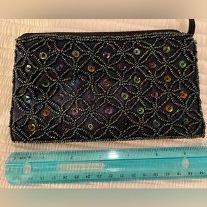 LAST CHANCE - Sequined small zip purse. About 7” by 4”. Black satin.